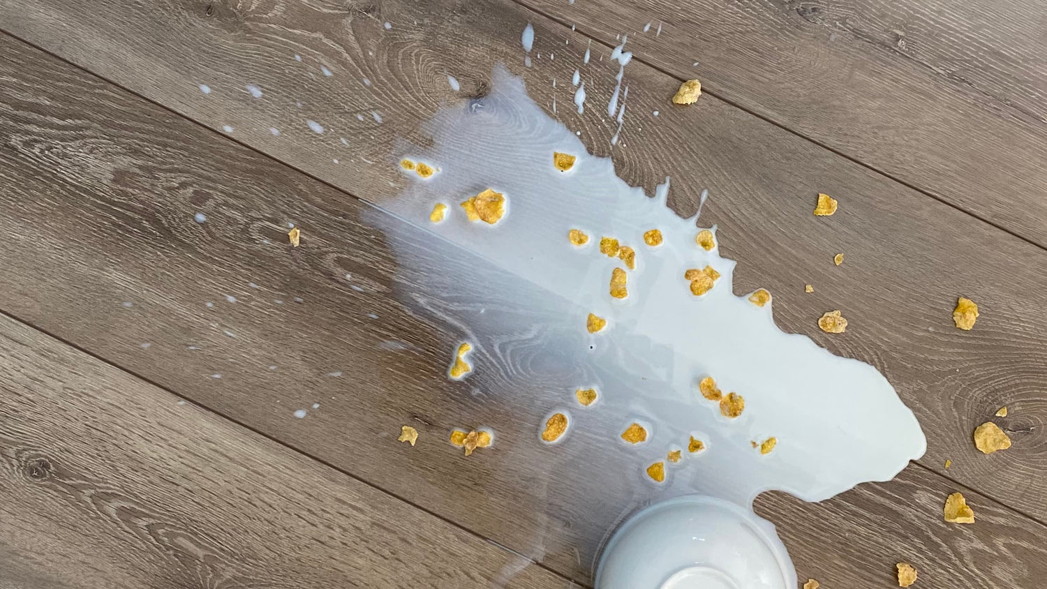Milk spill with cereal on LifeProtect wood-core flooring
